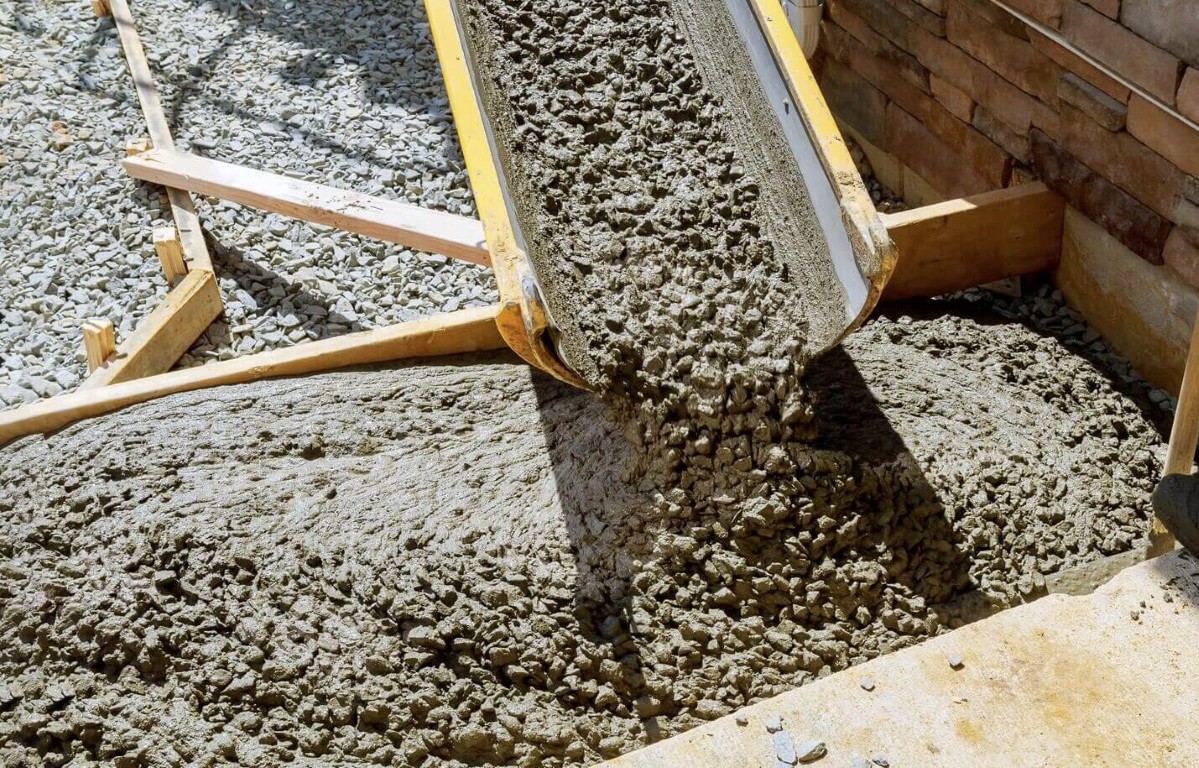 High-quality concrete being poured during professional installation in Jackson, MS