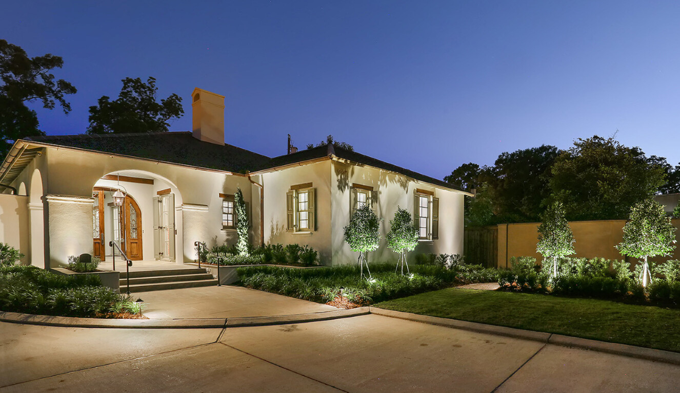 Elegant stamped decorative concrete driveway with landscape lighting in Jackson, MS